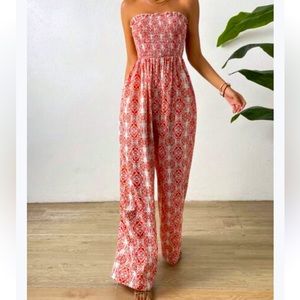 Sleeveless jumpsuit, stretch bodice and wide leg flowy pant size Medium